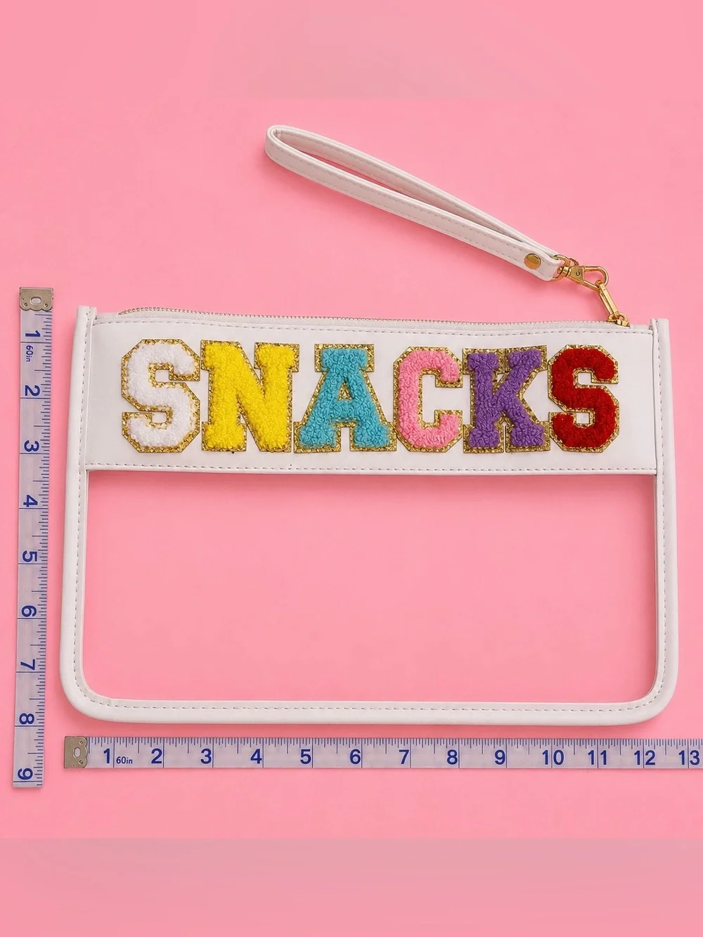 White Wristlet Clutch with 'SNACKS' Multicolor Lettering